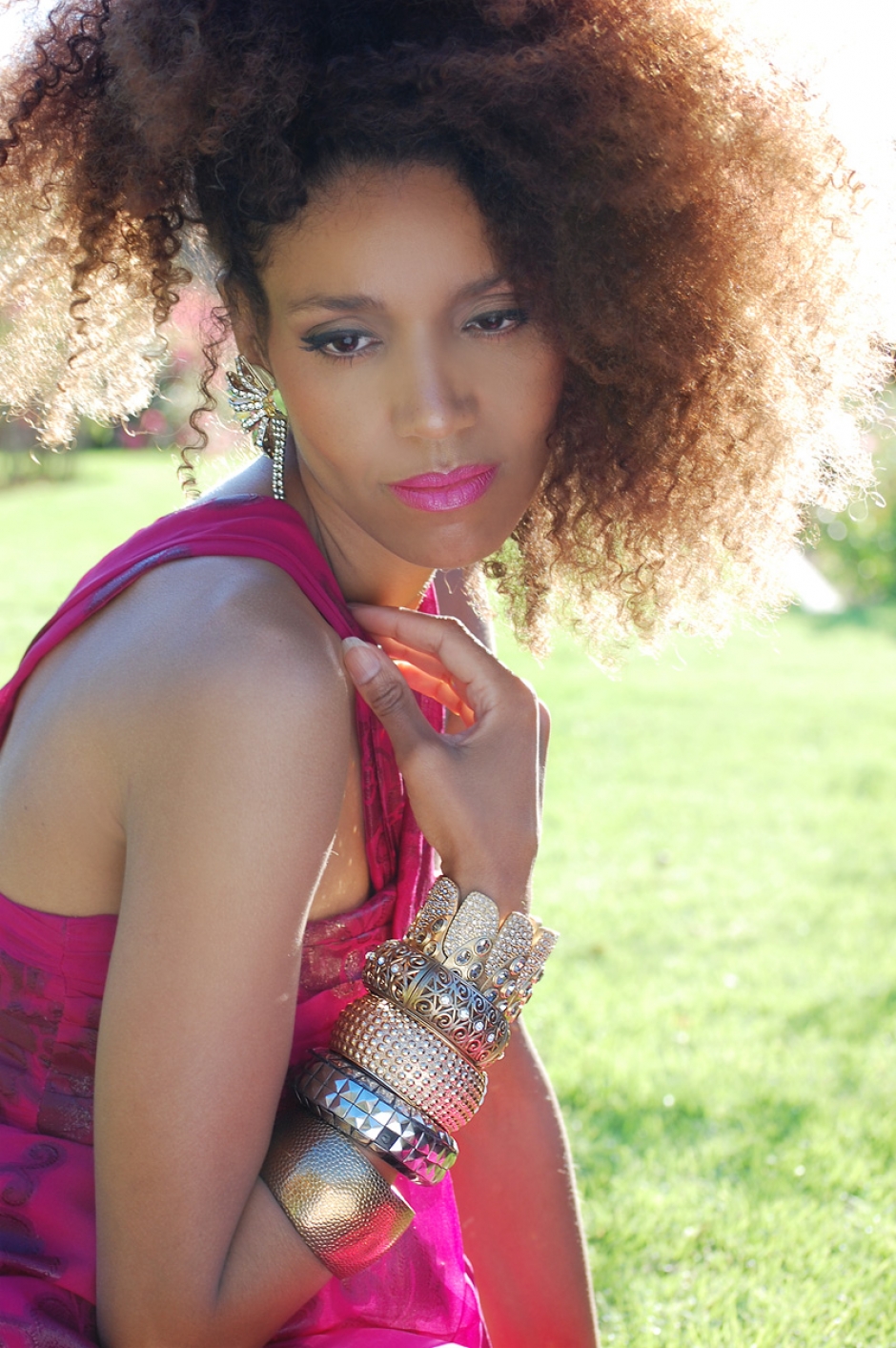 Ndoema wears a summer floral maxi-dress by Nicole Miller