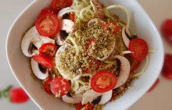 Pumpkin Seed Parmesan on zucchini pasta
