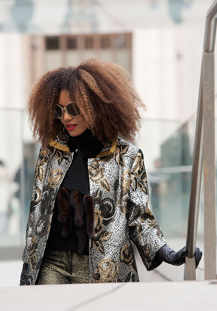 The Global Girl: Ndoema stars in a fashion editorial photographed by Paris-based photographer Kamel Lahmadi of Style and the City. Ndoema wears sunglasses by The Guise Archives, vintage silver and gold brocade coat, vintage gold chain and patent leather purse, Betsey Johnson gold glitter platform pumps, vintage black leather gloves, H&M gold metallic pants and vintage wool and fur scarf.