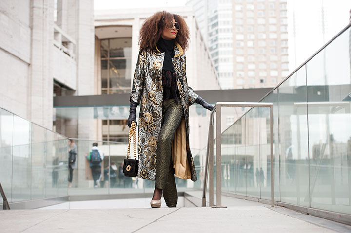 The Global Girl: Ndoema stars in a fashion editorial photographed by Paris-based photographer Kamel Lahmadi of Style and the City. Ndoema wears sunglasses by The Guise Archives, vintage silver and gold brocade coat, vintage gold chain and patent leather purse, Betsey Johnson gold glitter platform pumps, vintage black leather gloves, H&M gold metallic pants and vintage wool and fur scarf.