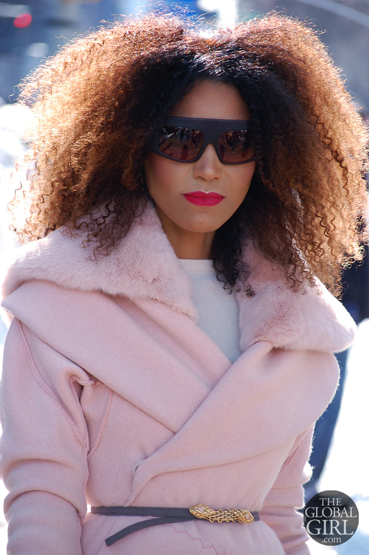 The Global Girl Daily Style: Ndoema rocks an all pink outfit with purple oversized Phillip Lim sunglasses as she arrives at Lincoln Center during New York Fashion Week.