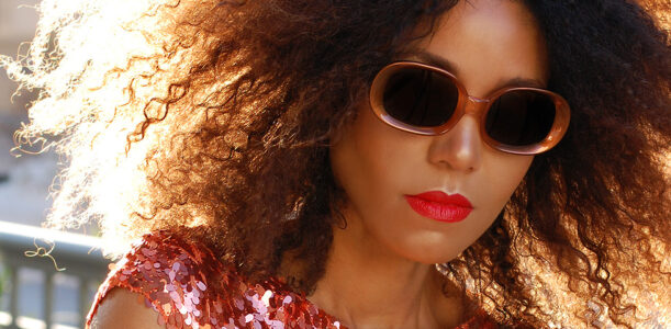 alt="The Global Girl Daily Style: Ndoema dons a sequin mini dress from Son Jung Wan Spring 2014 with mod rounded sunglasses by Halston."