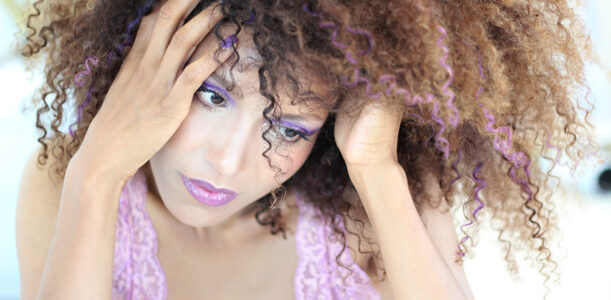 Ndoema rocks her trademark curly hair styled with Garnier Color Styler in Purple Mania, in a "purple everything" look complete with purple curls, purple smokey eyes and bold purple lips. #purplehair #purpleeverything