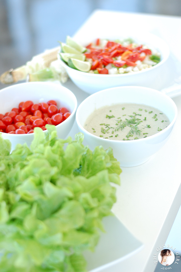 Crunchy corn salad with creamy dairy free dressing on a bed of curly leaf lettuce. Totally raw, vegan, gluten free and oil free.