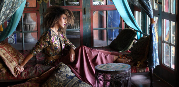 The Global Girl Fashion Editorials: Ndoema lounges Moroccan style in an opulent day bed in this photo shoot lensed by Phillip James. She sports a bohemian chic look complete with silk palazzo pants styled with a vintage sequined paisley blouse and Miu Miu jeweled sandals.