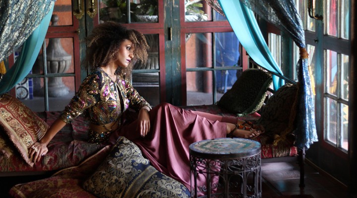 The Global Girl Fashion Editorials: Ndoema lounges Moroccan style in an opulent day bed in this photo shoot lensed by Phillip James. She sports a bohemian chic look complete with silk palazzo pants styled with a vintage sequined paisley blouse and Miu Miu jeweled sandals.