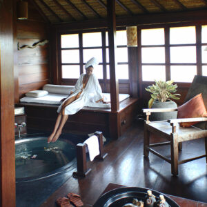 alt="The Global Girl Travels: Ndoema luxuriates in her exotic Indonesian beach front suites with private attached spa. Canggu Beach, Bali."