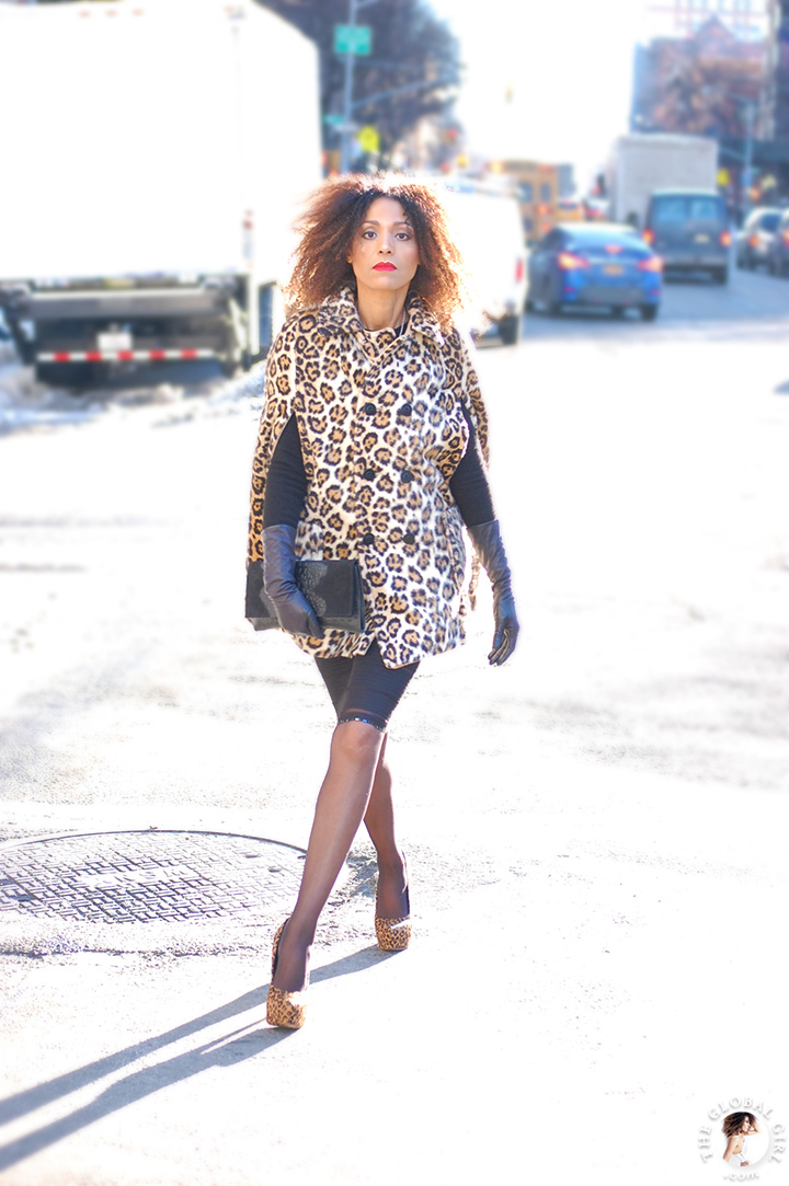 New York Fashion Week Street Style: Ndoema goes for animal prints in leopard cape and matching platform pumps.