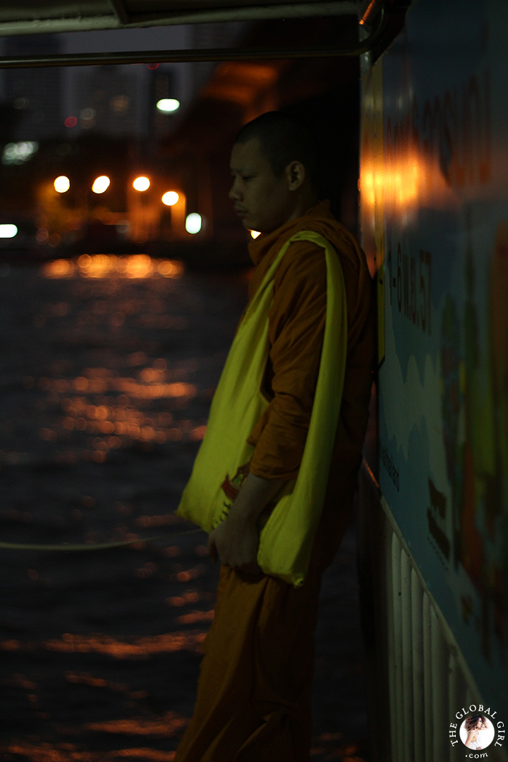 The Global Girl Travels: A meditative monk on the Chao Phraya river in Bangkok, Thailand.