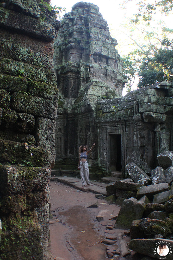 The Global Girl Travels: Ndoema strolls through the ruins of Ta Prohm's jungle temple in Cambodia.