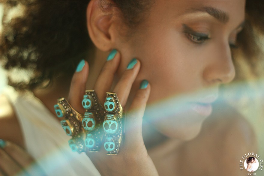 The Global Girl Fashion: Ndoema sports multiple turquoise and brass skull rings.