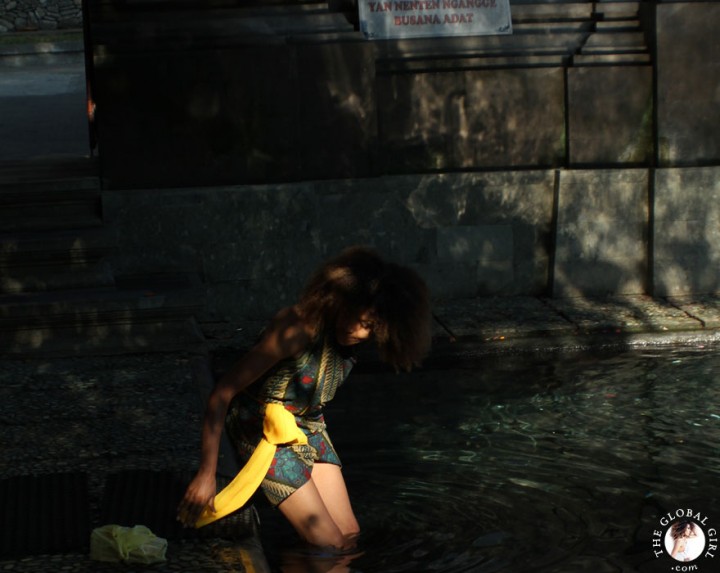 The Global Girl Travels: Ndoema bathing in holy spring water at the Tirta Empul Holy Temple in Bali, Indonesia.