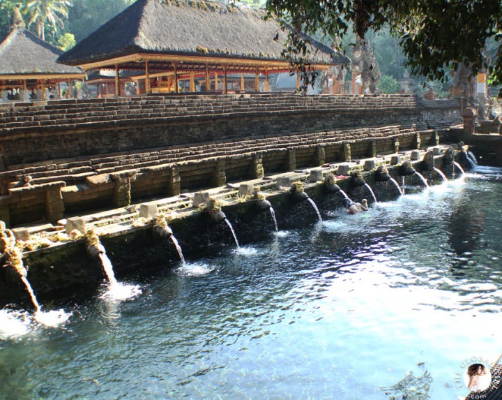 The Global Girl Travels: Ndoema bathing in holy spring water at the Tirta Empul Temple in Bali, Indonesia.