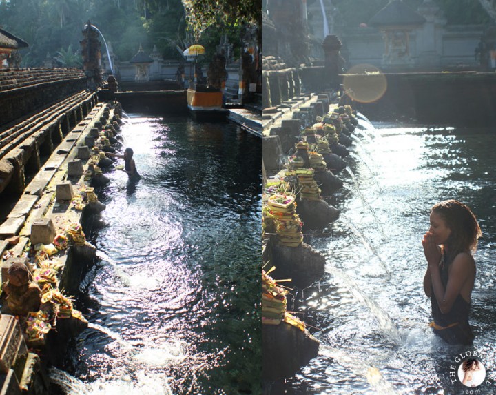 The Global Girl Travels: Ndoema bathing in holy spring water at the Tirta Empul Holy Temple in Bali, Indonesia.