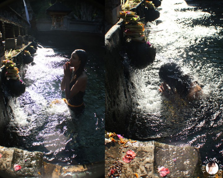 The Global Girl Travels: Ndoema bathing in holy spring water at the Tirta Empul Temple in Bali, Indonesia.