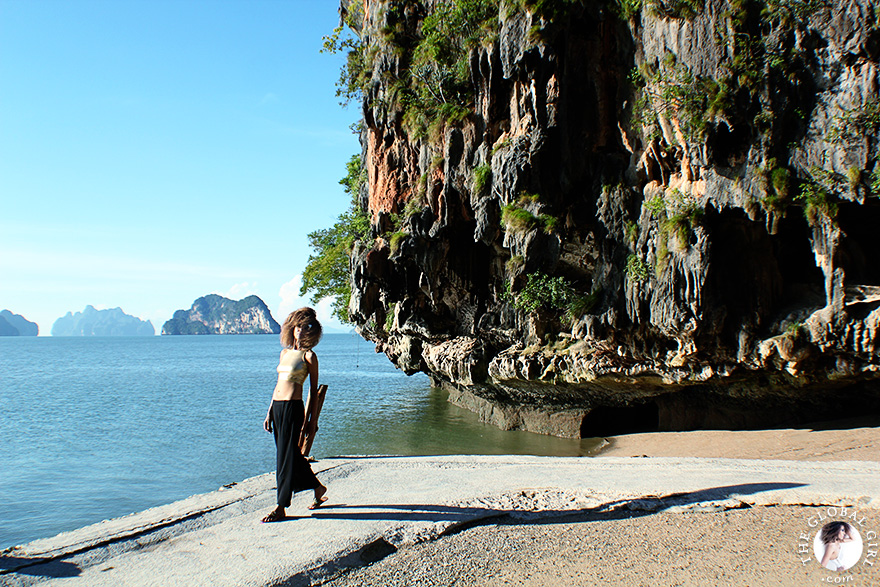 The Global Girl Travels: Ndoema sports a gold crop top with rasoir cat eye sunglasses while exploring beautiful James Bond Island in the Phang Nga Bay, Thailand.