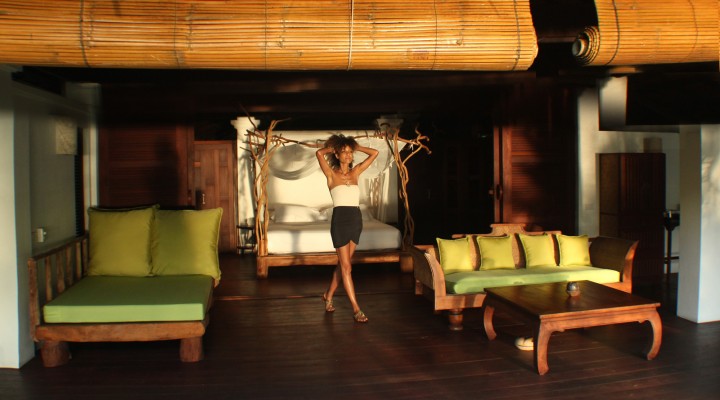 The Global Girl Travels: Ndoema greets the sunrise in her open style bedroom at Glamping Hub's eco-friendly resort in Ko Yao Noi, Southern Thailand.