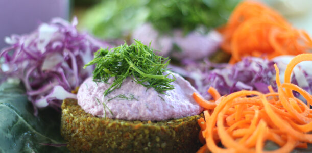 The Global Girl Raw Food Recipes: Carrot & Dill Burgers in collard green leaf with shredded red cabbage, romaine lettuce and carrots. 100% raw, vegan and gluten-free.