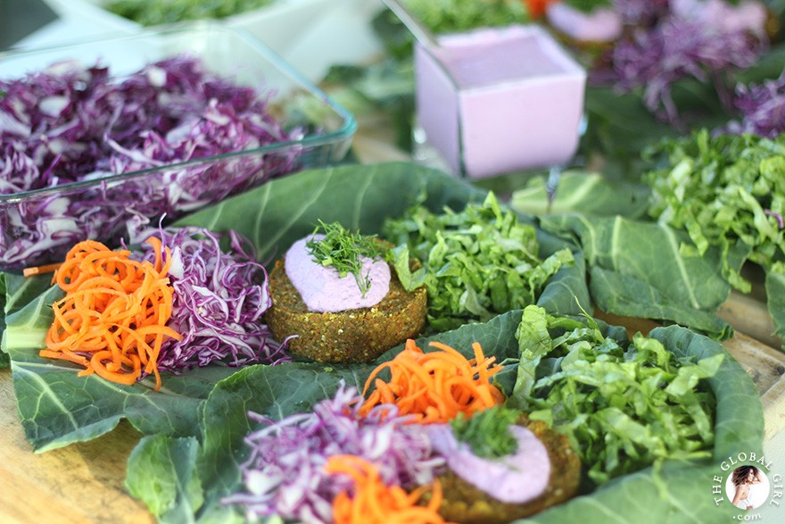 The Global Girl Raw Food Recipes: Carrot & Dill Burgers in collard green leaf with shredded red cabbage, romaine lettuce, carrots and red onion. 100% raw, vegan and gluten-free.