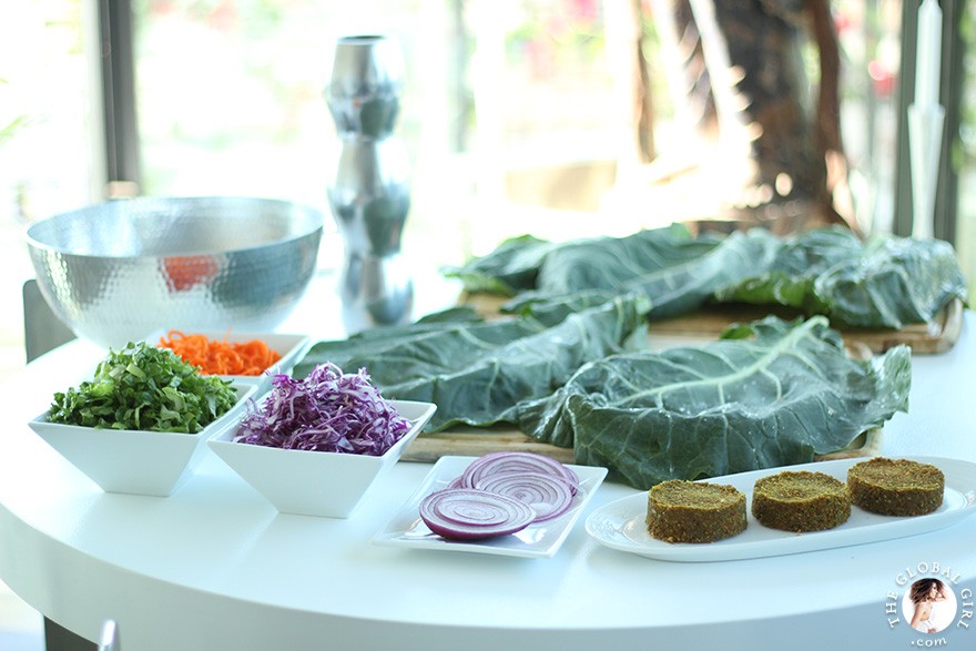 The Global Girl Raw Food Recipes: Carrot & Dill Burgers in collard green leaf with shredded red cabbage, romaine lettuce, carrots and red onion. 100% raw, vegan and gluten-free.