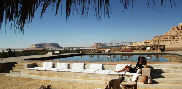 The Global Girl Travels: Relaxed and chic in a Moroccan-inspired batwing dress and tribal bracelets, Ndoema explores desert eco-chic living at luxury eco-lodge Talist at Siwa Oasis in the Libyan desert.
