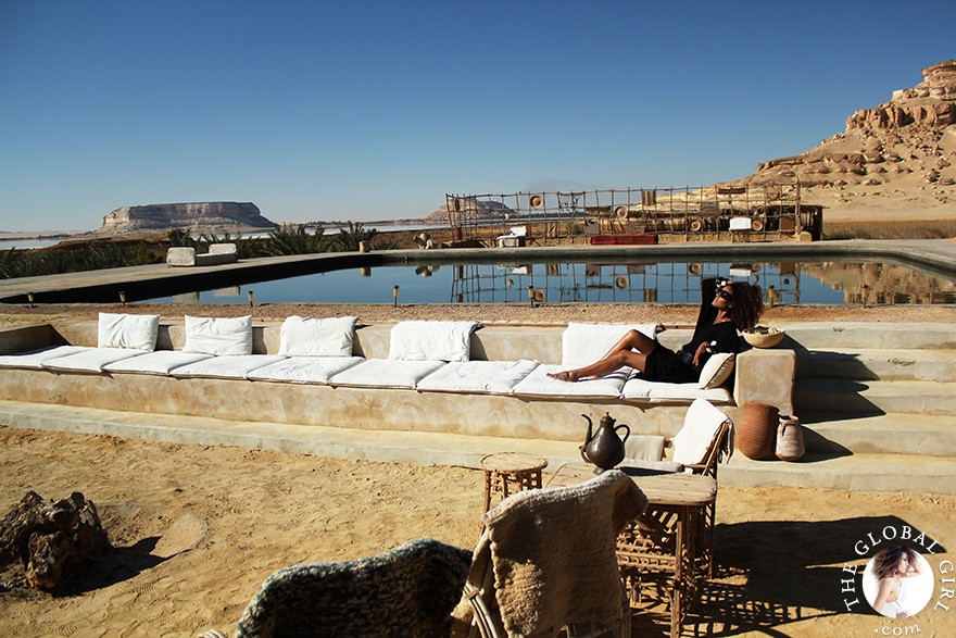 The Global Girl Travels: Relaxed and chic in a Moroccan-inspired batwing dress and tribal bracelets, Ndoema explores desert eco-chic living at luxury eco-lodge Talist at Siwa Oasis in the Libyan desert.