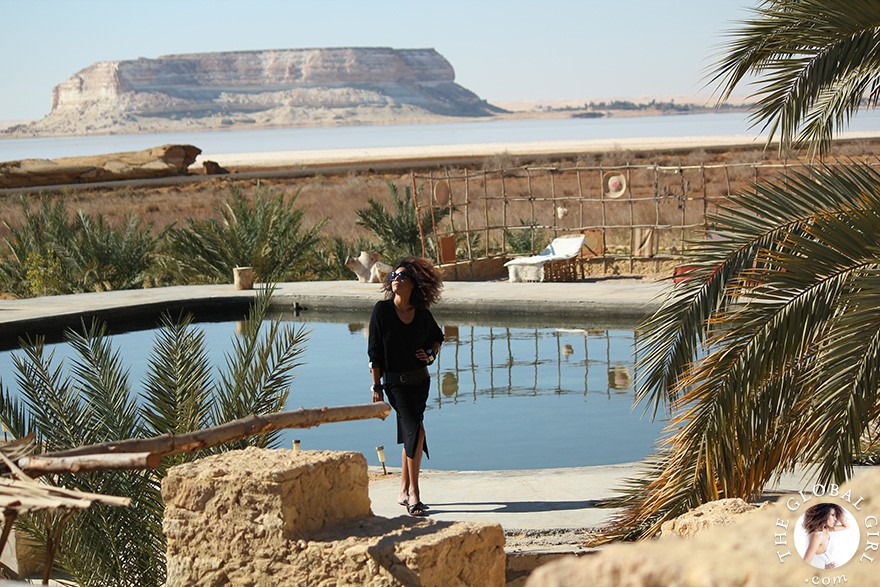 The Global Girl Travels: Relaxed and chic in a Moroccan-inspired batwing dress and tribal bracelets, Ndoema explores desert eco-chic living at luxury eco-lodge Talist at Siwa Oasis in the Libyan desert.