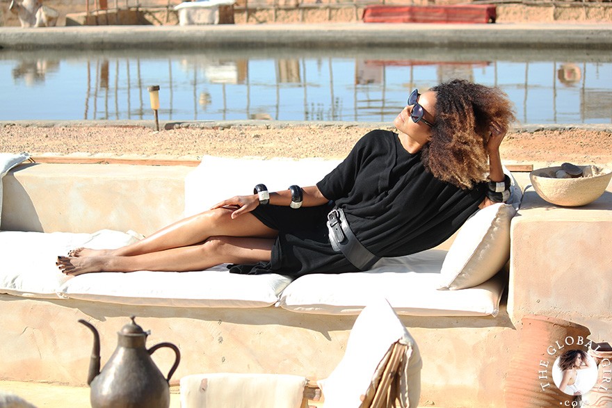 The Global Girl Travels: Relaxed and chic in a Moroccan-inspired batwing dress and tribal bracelets, Ndoema explores desert eco-chic living at luxury eco-lodge Talist at Siwa Oasis in the Libyan desert.