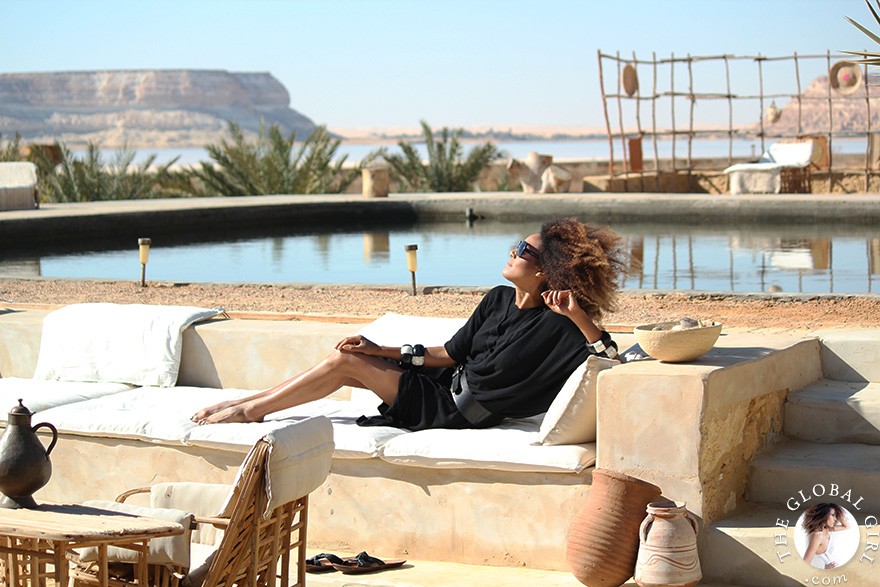 The Global Girl Travels: Relaxed and chic in a Moroccan-inspired batwing dress and tribal bracelets, Ndoema explores desert eco-chic living at luxury eco-lodge Talist at Siwa Oasis in the Libyan desert.