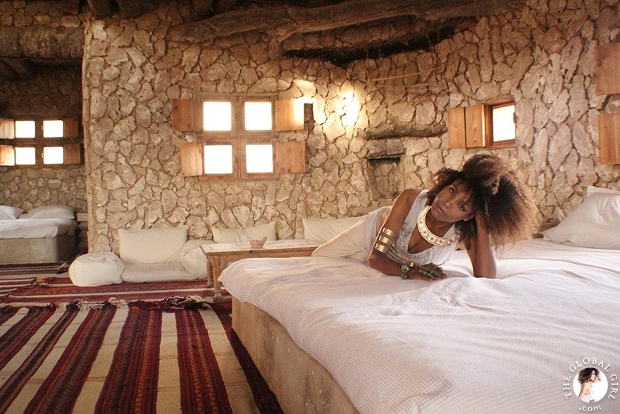 The Global Girl Daily Style: Ndoema channels boho chic style in ethnic-inspired beaded tank by Antik Batik, silk palazzo pants by Robert Rodriguez, jeweled sandals by Miu Miu and her own collection of tribal jewelry. Photographed at the Adrère Amellal luxury eco-friendly desert resort at Siwa Oasis, Egypt.