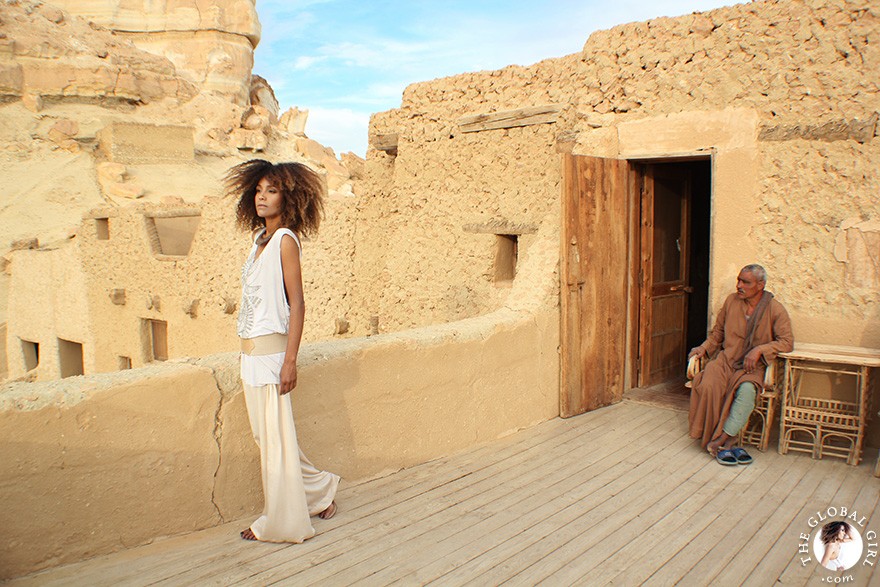The Global Girl Daily Style: Ndoema channels boho chic style in ethnic-inspired beaded tank by Antik Batik, silk palazzo pants by Robert Rodriguez, jeweled sandals by Miu Miu and her own collection of tribal jewelry. Photographed at the Adrère Amellal luxury eco-friendly desert resort at Siwa Oasis, Egypt.