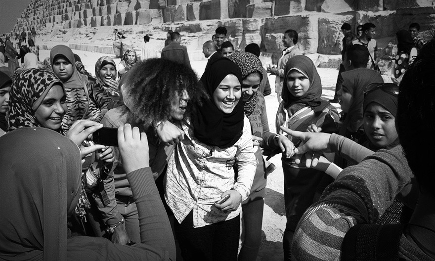 The Global Girl Community: Ndoema gets flash-mobbed by Egyptian teens fans at the foot of the Great Pyramid of Giza, Egypt.