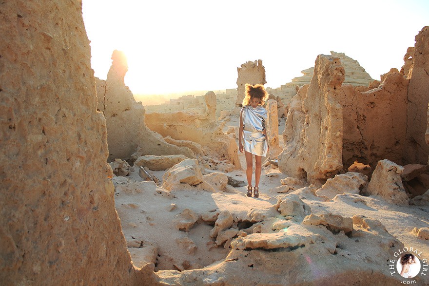 The Global Girl Fashion Editorials: Ndoema goes futuristic in a silver metallic dress by Australian designer Ellery against the ancient ruins of Shali Ghadi, a spectacular 13th-century fortress at Siwa Oasis, Egypt.