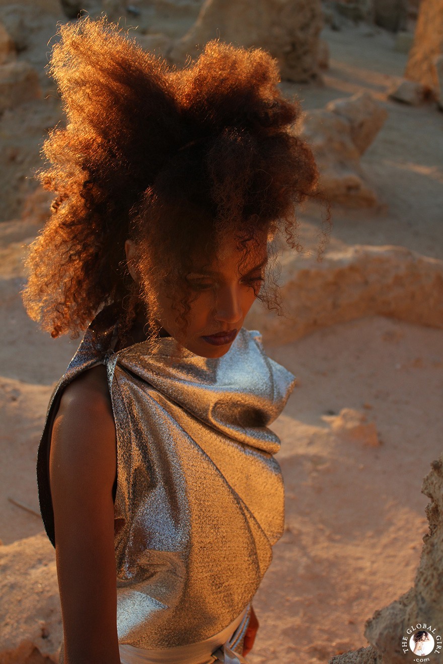 The Global Girl Fashion Editorials: Ndoema goes futuristic in a silver metallic dress by Australian designer Ellery against the ancient ruins of Shali Ghadi, a spectacular 13th-century fortress at Siwa Oasis, Egypt.