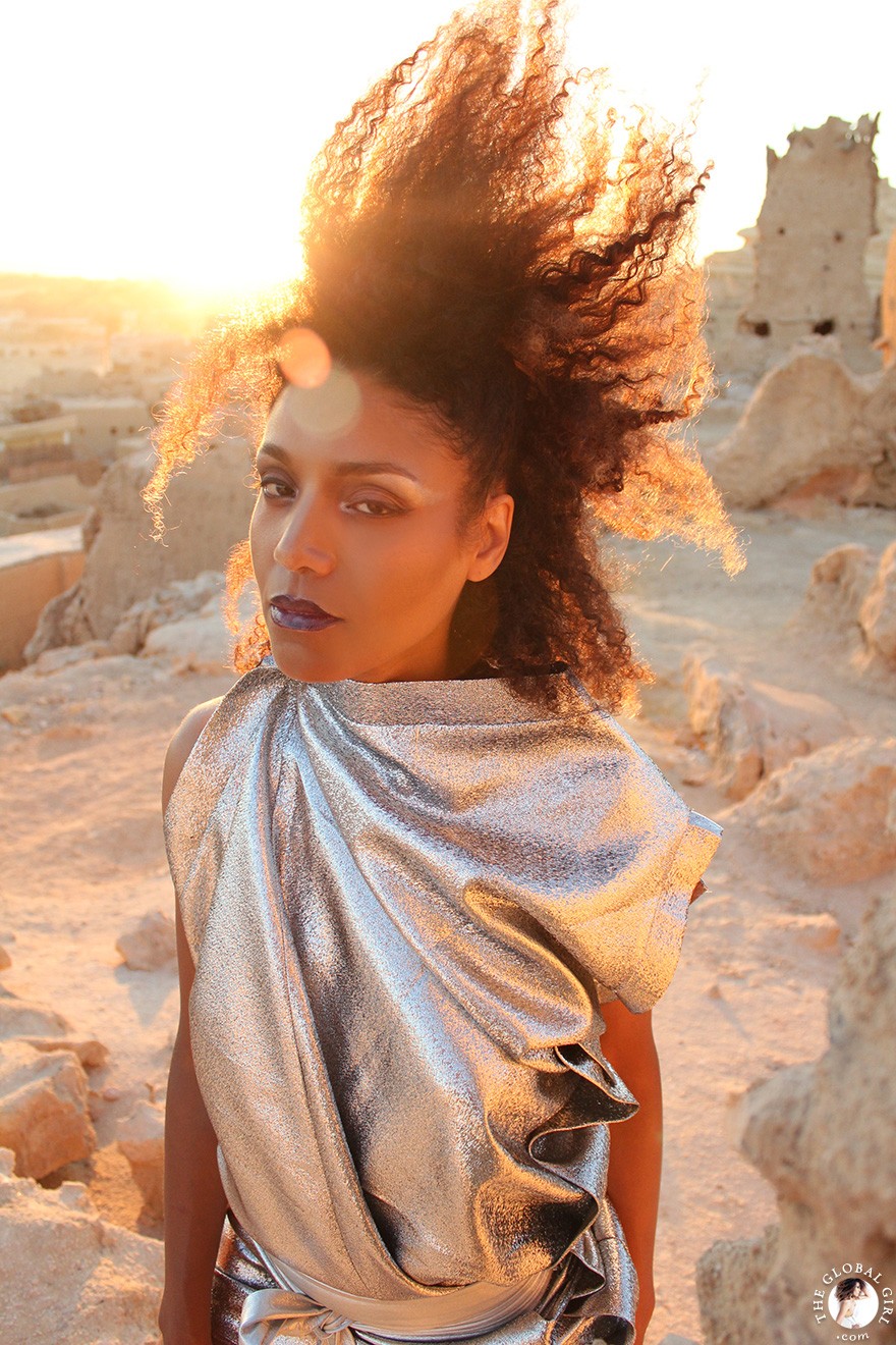 The Global Girl Fashion Editorials: Ndoema goes futuristic in a silver metallic dress by Australian designer Ellery against the ancient ruins of Shali Ghadi, a spectacular 13th-century fortress at Siwa Oasis, Egypt.