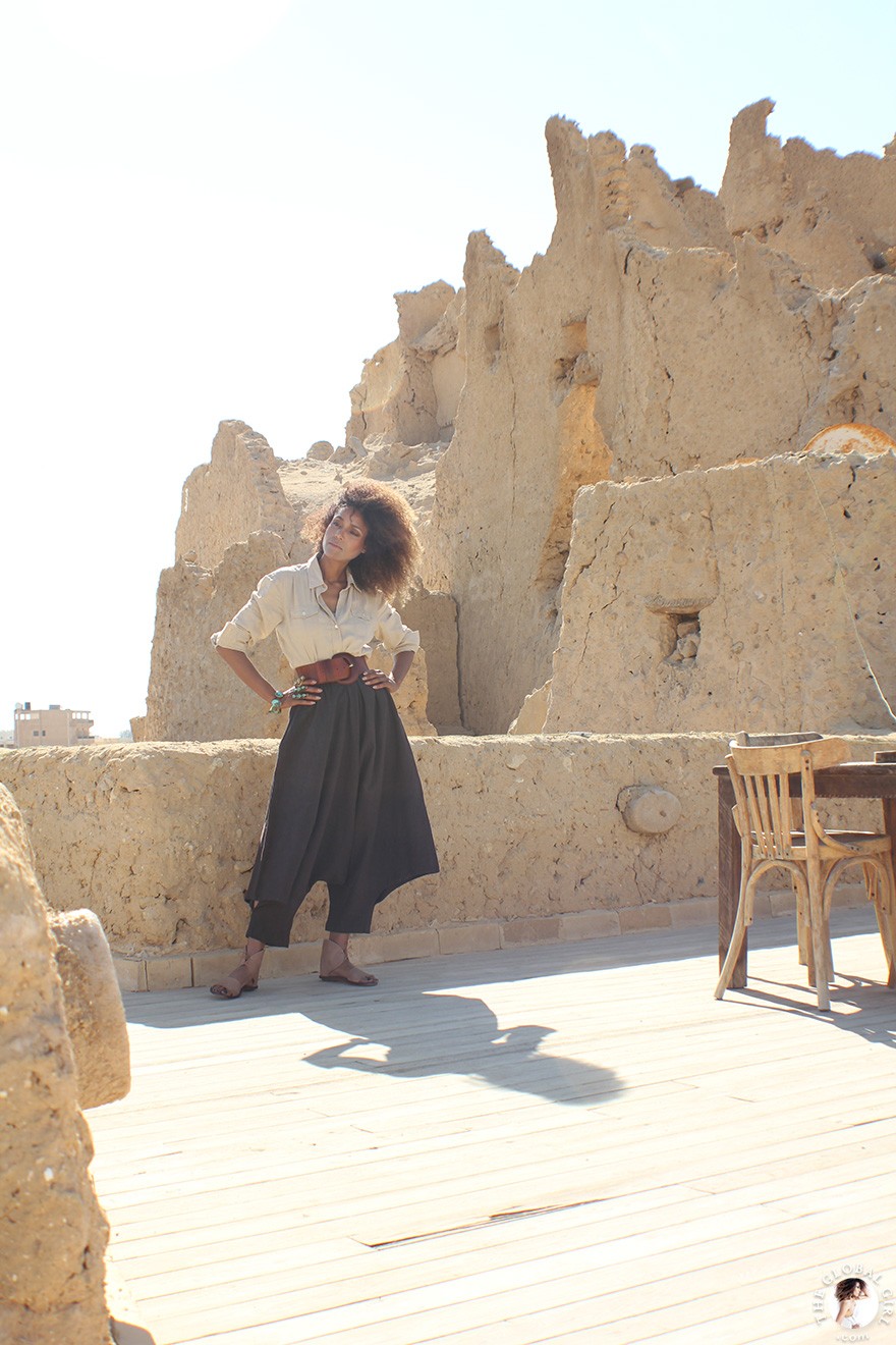 The Global Girl Travels: Ndoema goes monochromatic in earth toned tribal harem pants, safari shirt and ankle tie sandals at the Al-Babinshal Heritage hotel in Siwa, Egypt.