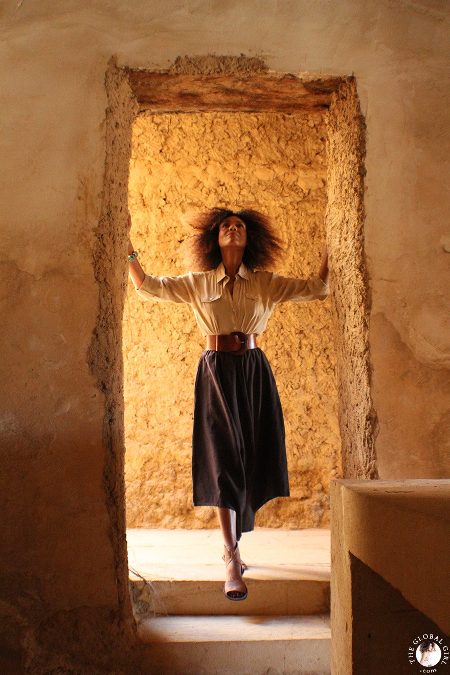 The Global Girl Travels: Ndoema goes monochromatic in earth toned tribal harem pants, safari shirt and ankle tie sandals at the Al-Babinshal Heritage hotel in Siwa, Egypt.