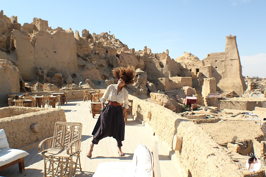 The Global Girl Travels: Ndoema goes monochromatic in earth toned tribal harem pants, safari shirt and ankle tie sandals at the Al-Babinshal Heritage hotel in Siwa, Egypt.