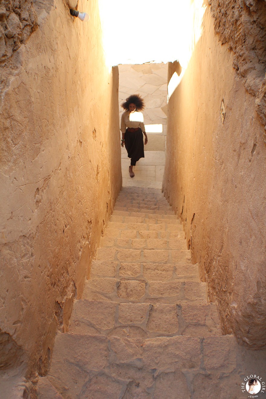 The Global Girl Travels: Ndoema goes monochromatic in earth toned tribal harem pants, safari shirt and ankle tie sandals at the Al-Babinshal Heritage hotel in Siwa, Egypt.