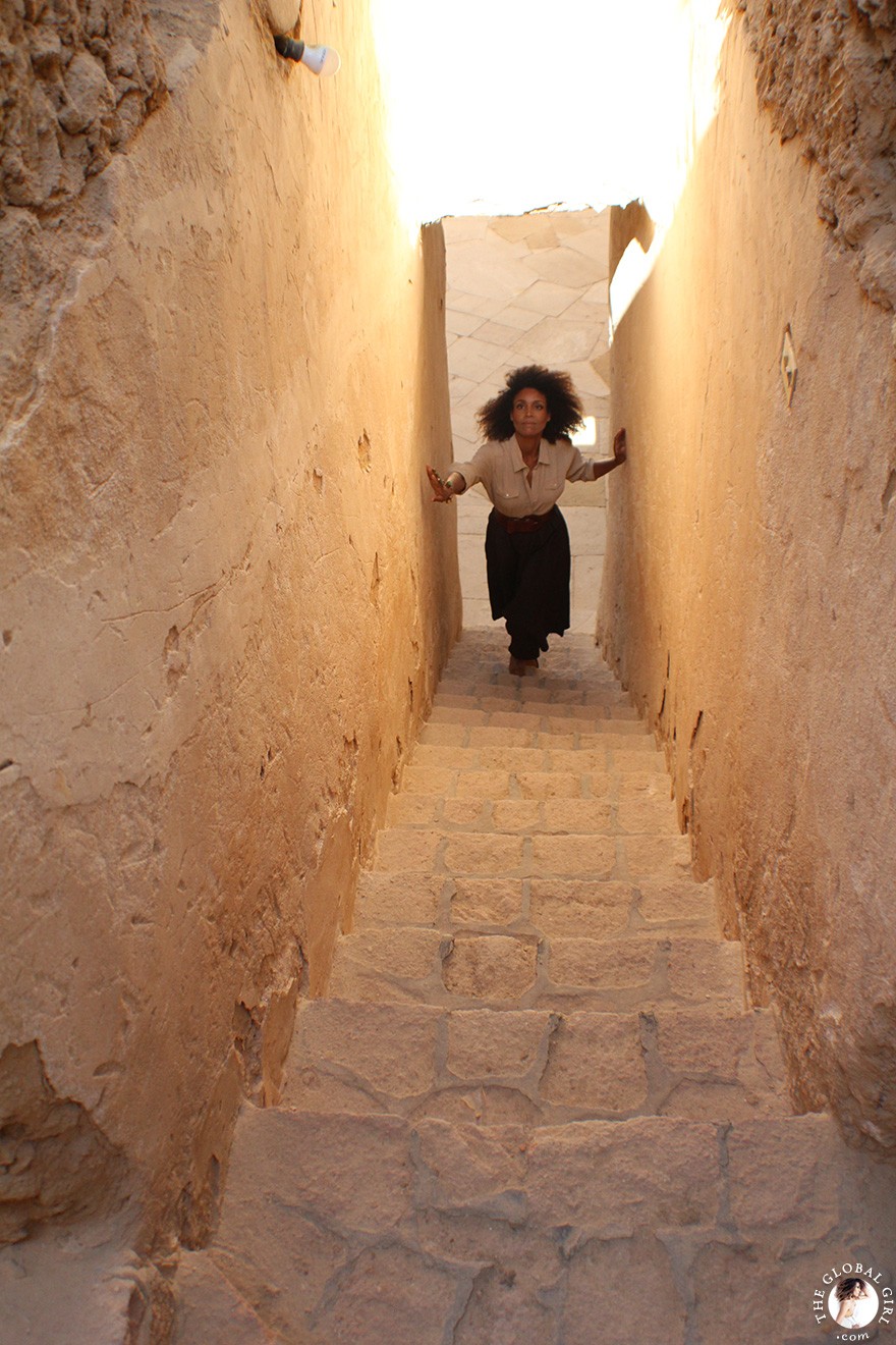 The Global Girl Travels: Ndoema goes monochromatic in earth toned tribal harem pants, safari shirt and ankle tie sandals at the Al-Babinshal Heritage hotel in Siwa, Egypt.