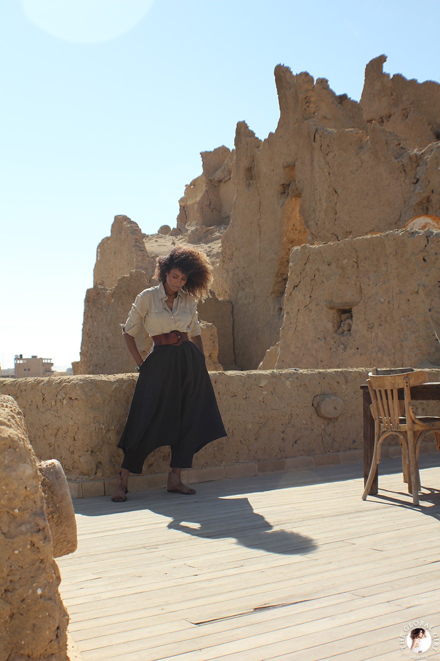 The Global Girl Travels: Ndoema goes monochromatic in earth toned tribal harem pants, safari shirt and ankle tie sandals at the Al-Babinshal Heritage hotel in Siwa, Egypt.