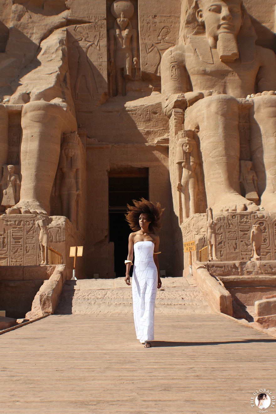 The Global Girl Travels: Ndoema arrives at the Abu Simbel temples in a white strapless maxi dress by Alexis. Photographed in Nubia, southern Egypt, near the border with Sudan.