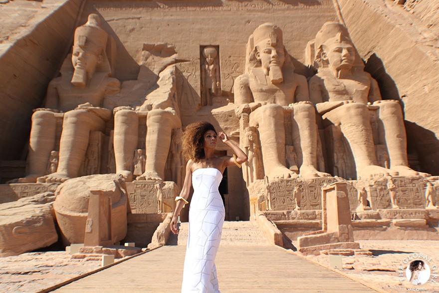 The Global Girl Travels: Ndoema arrives at the Abu Simbel temples in a white strapless maxi dress by Alexis. Photographed in Nubia, southern Egypt, near the border with Sudan.