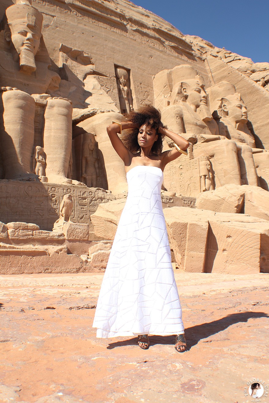 The Global Girl Travels: Ndoema arrives at the Abu Simbel temples in a white strapless maxi dress by Alexis. Photographed in Nubia, southern Egypt, near the border with Sudan.