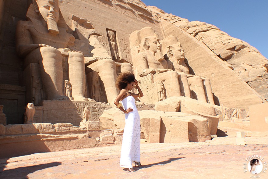 The Global Girl Travels: Ndoema arrives at the Abu Simbel temples in a white strapless maxi dress by Alexis. Photographed in Nubia, southern Egypt, near the border with Sudan.