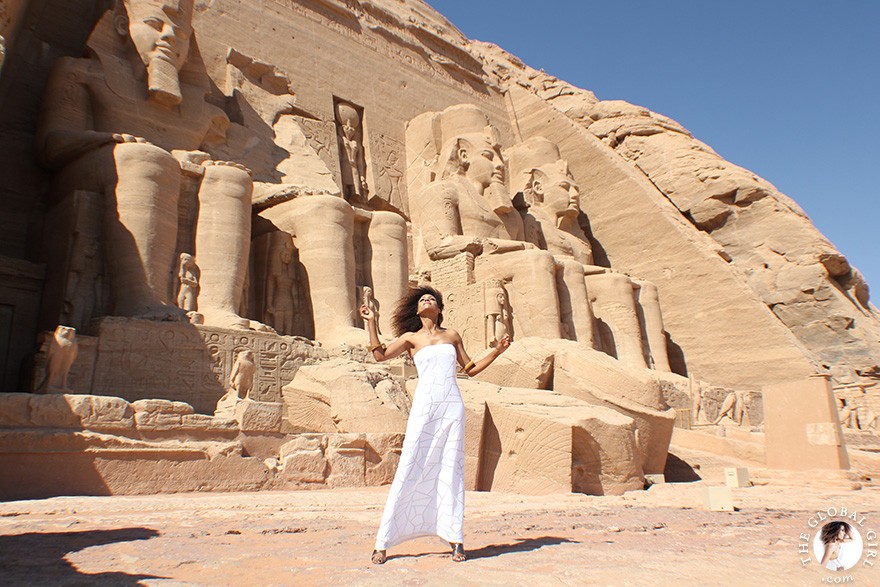 The Global Girl Travels: Ndoema arrives at the Abu Simbel temples in a white strapless maxi dress by Alexis. Photographed in Nubia, southern Egypt, near the border with Sudan.