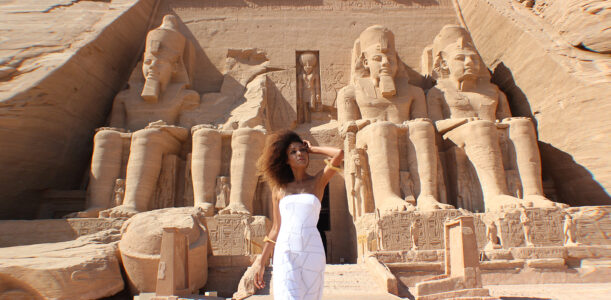 The Global Girl Travels: Ndoema arrives at the Abu Simbel temples in a white strapless maxi dress by Alexis. Photographed in Nubia, southern Egypt, near the border with Sudan.