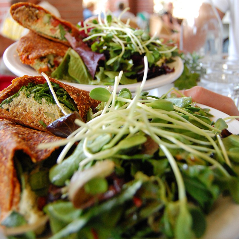 Raw vegan Mediterranean wrap with live falafels at vegan restaurant Cafe Gratitude in Venice, California." border="0" />