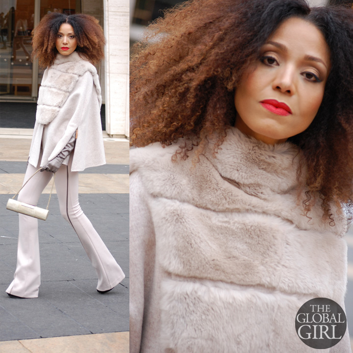 The Global Girl Style: Ndoema rocks the winter cape look in a beige Son Jung Wan cape and flare pants ensemble with Sergio Rossi bag during New York Fashion Week Fall 2014.