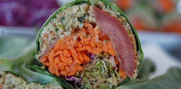 The Global Girl Raw Vegan Recipes: Falafel Burger Wrap in a collard creen Leaf with carrot, sprouts, tomato, red cabbage and red onion.